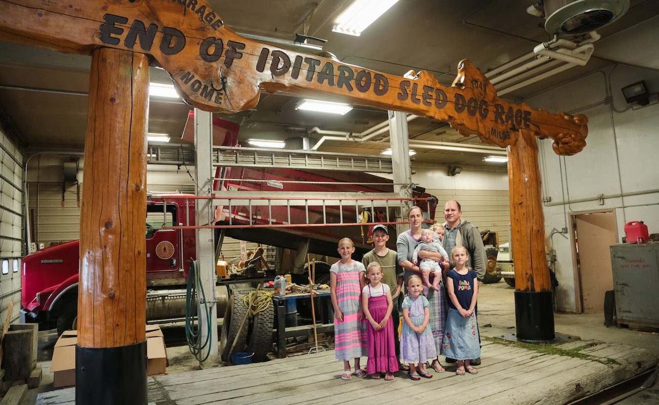 The Snader family poses under the famous burled arch - Missie Yoder