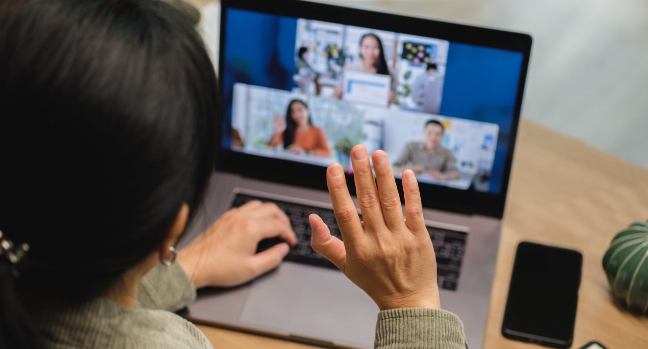 asisn woman video conference busienss meeting with colleage online with laptop at home